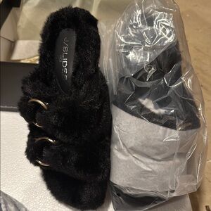 J/SLIDES Black Furry Slippers with Metallic Buckles